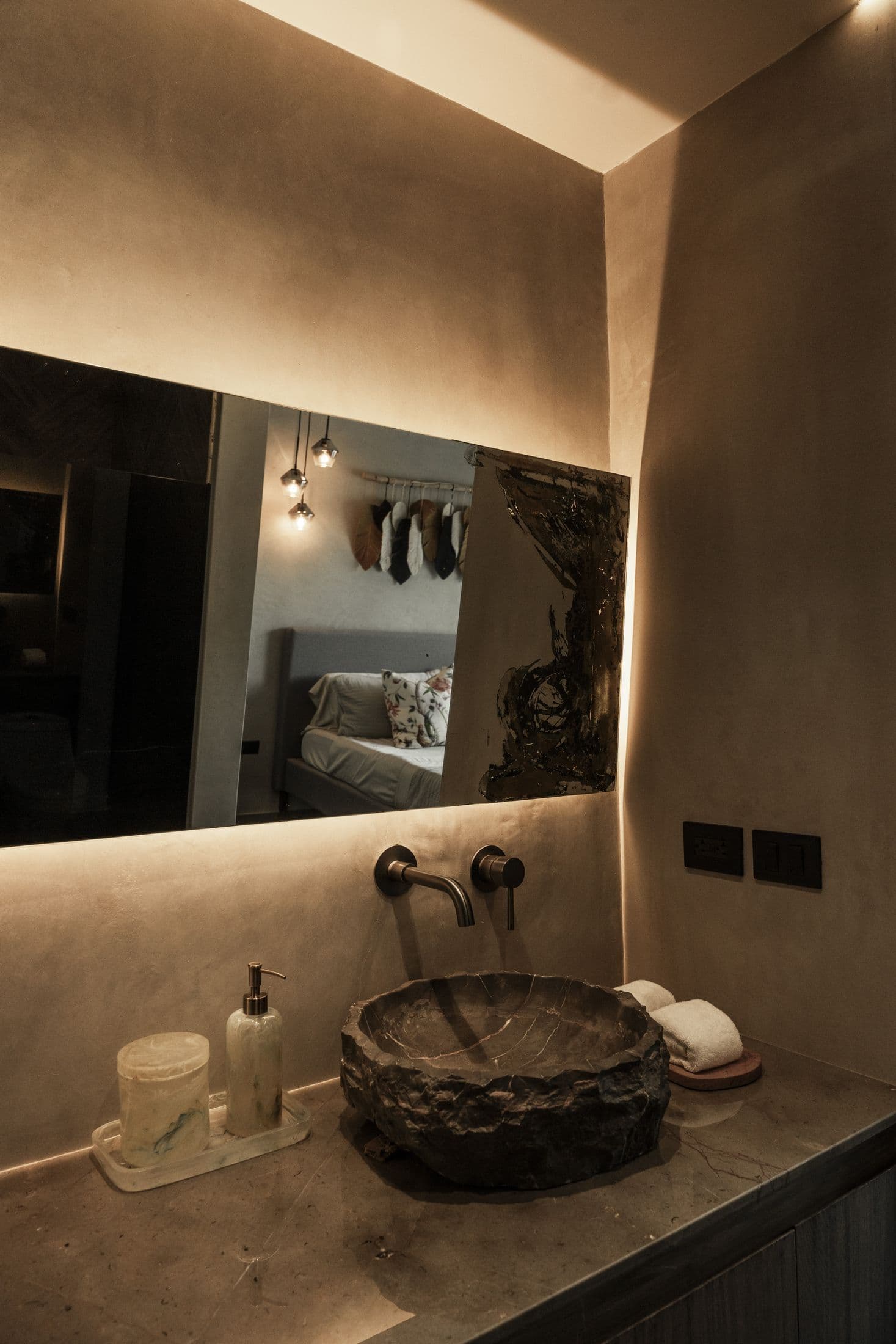 Carved stone sink and wall tap