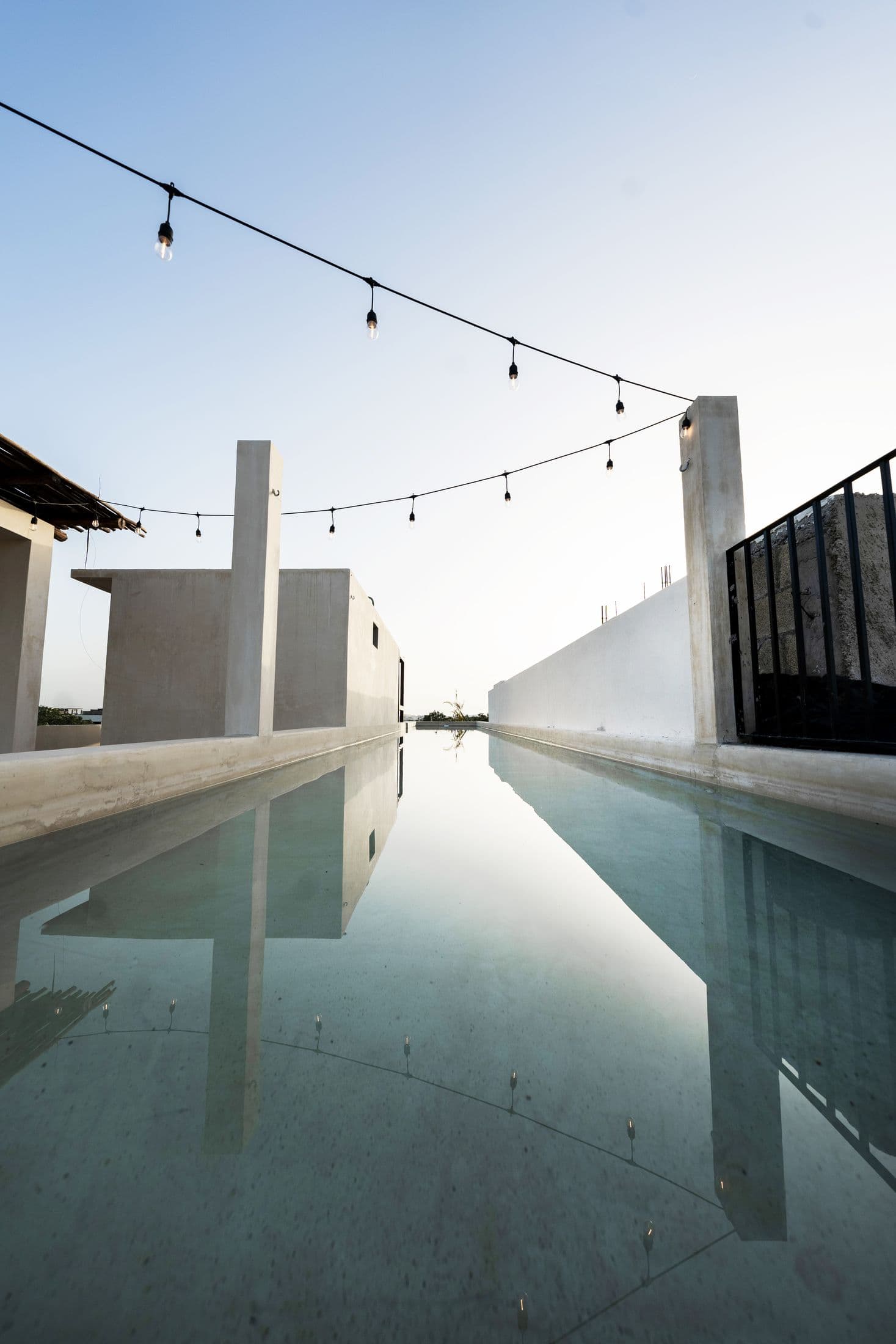 Rooftop pool with string lights